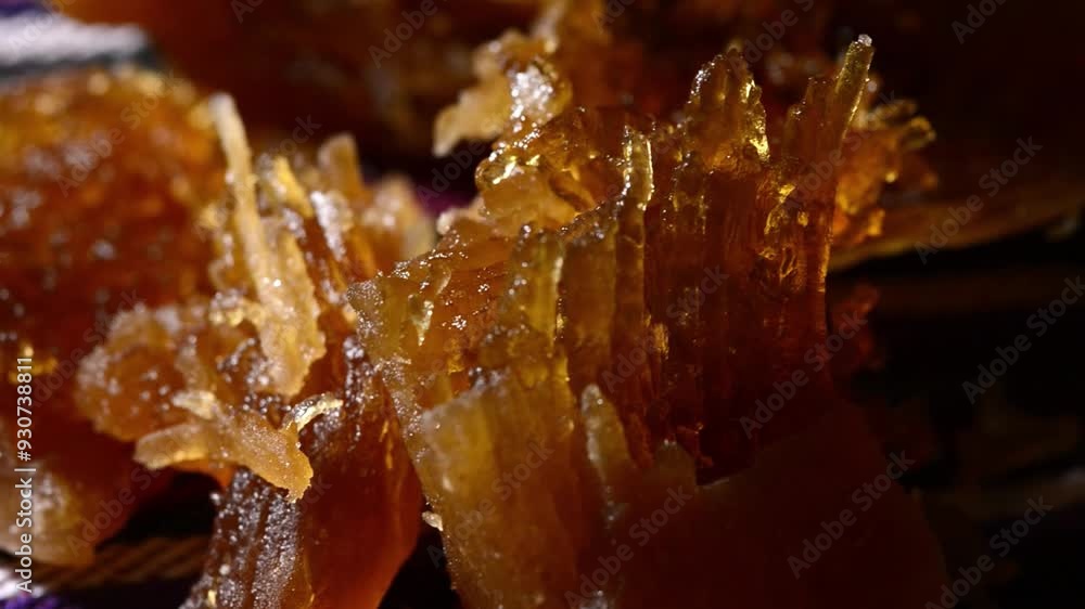 Close-up video of traditional Salvadoran Chilacayote candy, syrupy and sweet, showcasing rich textures and vibrant fairground colors.Close-up video of traditional Salvadoran Chilacayote candy, a sweet Close-up video of traditional Salvadoran Chilacayote candy, syrupy and sweet, showcasing rich textures and vibrant fairground colors.Close-up video of traditional Salvadoran Chilacayote candy, a sweet