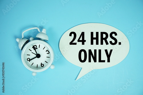 Photography 24 Hrs only text on speech bluble with alarm clock top view on blue background