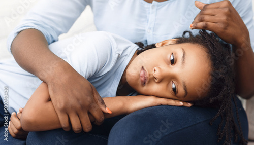 Family Support. Black woman comforting her offended kid who lying her head on mother's lap