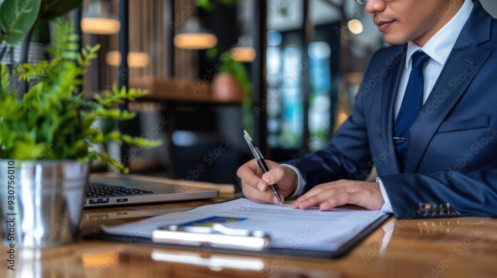 Businessman Signing a Contract Businessman Signing a Contract