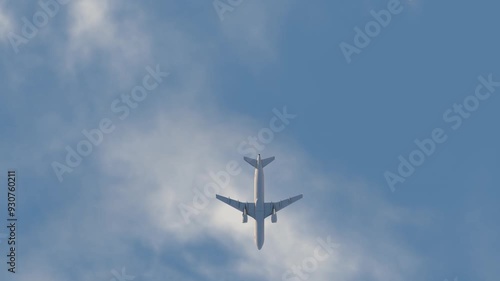 Photorealistic 3D Animation: Airplane Flying Overhead Against a Cloudy Sky