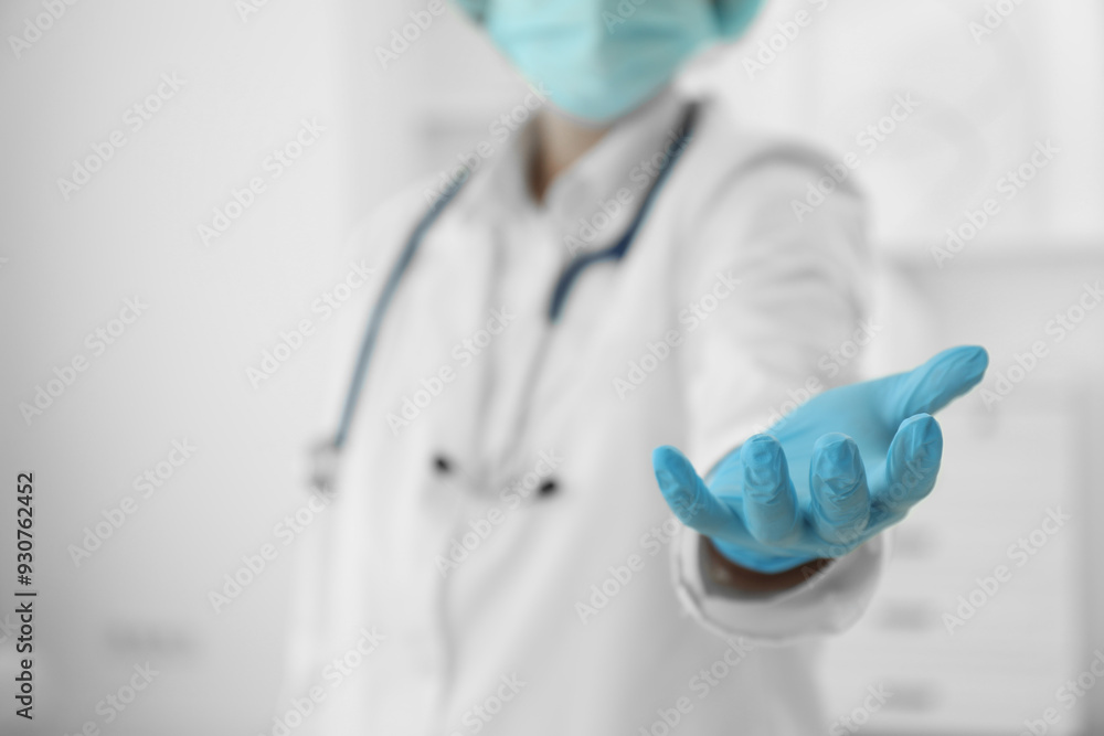 Doctor holding something in clinic, closeup view. Space for text Doctor holding something in clinic, closeup view. Space for text