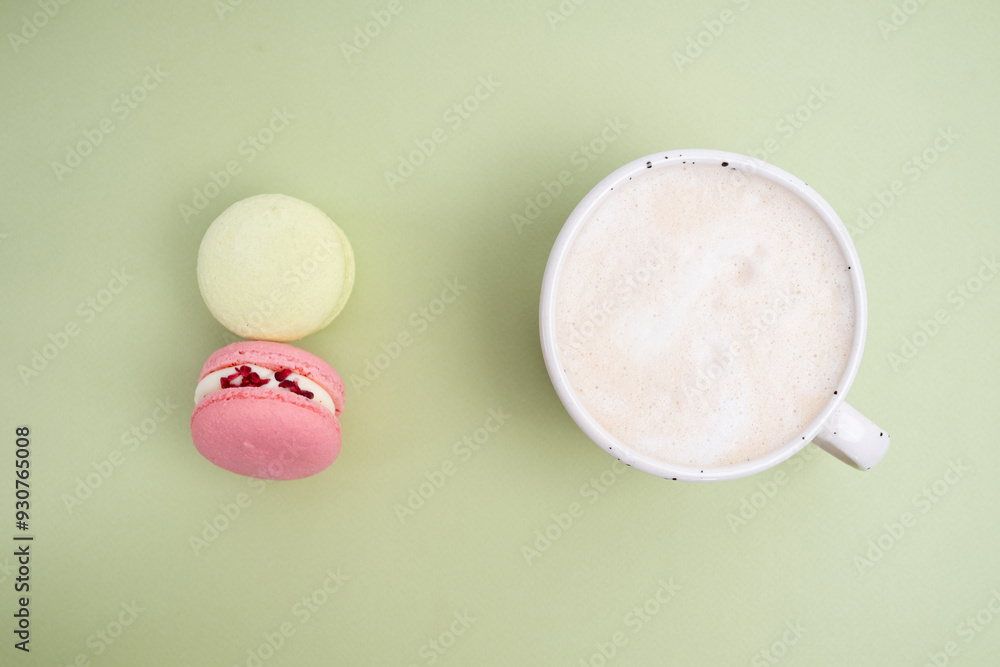 Macarons on a colored background, French cookies. Gift for March 8, International Women's Day, Valentine's Day. Sweets for coffee and tea Macarons on a colored background, French cookies. Gift for March 8, International Women's Day, Valentine's Day. Sweets for coffee and tea