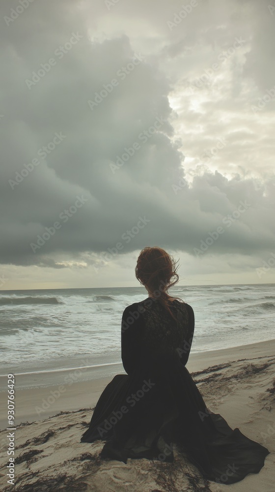 Woman in black dress sitting on the Woman in black dress sitting on the