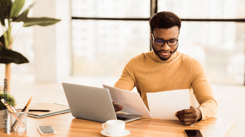 Fototapeta premium Checking Instructions. Confident black lawyer in glasses reading paper documents in modern office, panorama, copyspace