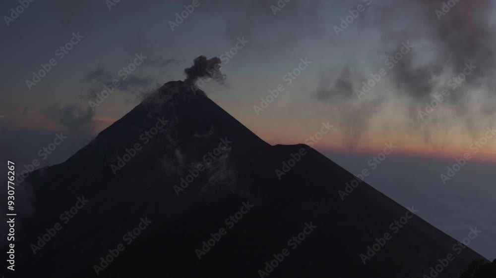 Aerial view of smoking volcano Acatenango in Guatemala during sunrise.