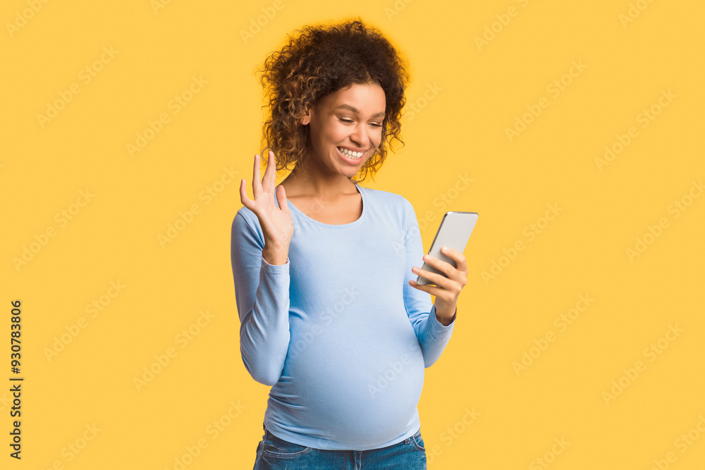 Happy pregnant woman having video call on cellphone and waving hand over white background Happy pregnant woman having video call on cellphone and waving hand over white background