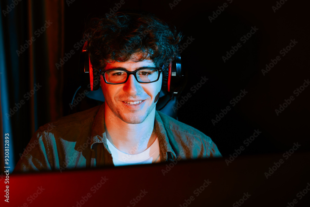 Young gaming streamer team getting winner players with Esport on pc online fighting wearing headphones in neon lighting room. Practising strategy plan to win competitors for next level. Gusher. Young gaming streamer team getting winner players with Esport on pc online fighting wearing headphones in neon lighting room. Practising strategy plan to win competitors for next level. Gusher.