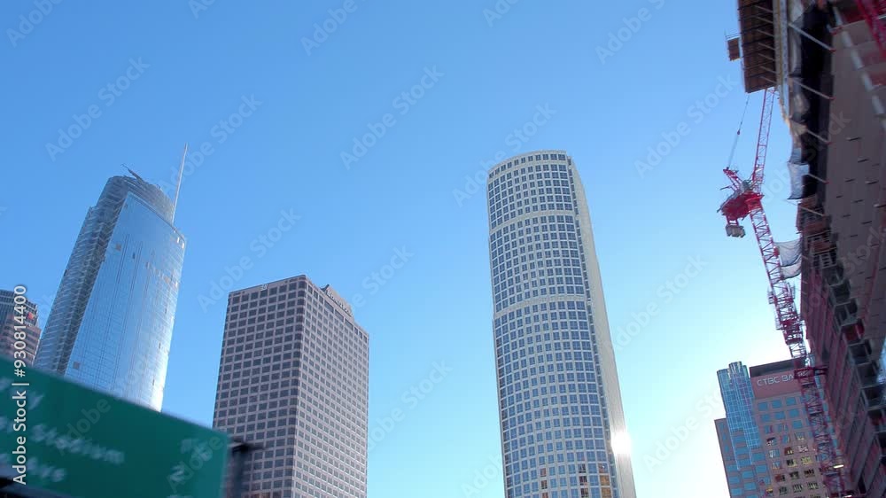 Point Of View Low Angle View Of Tall Modern Buildings Against Clear Sky In City On Sunny Day - Los Angeles, California Point Of View Low Angle View Of Tall Modern Buildings Against Clear Sky In City On Sunny Day - Los Angeles, California