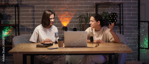 Beautiful women recording podcast in studio at night