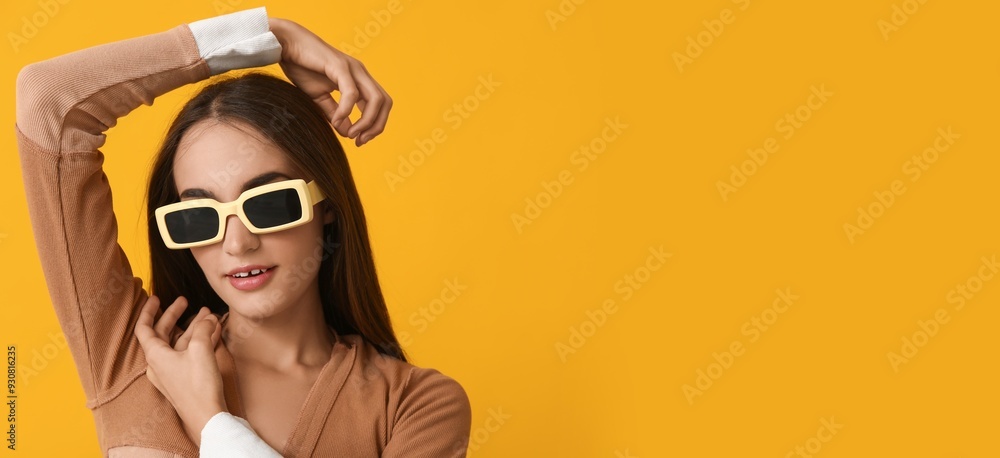 Young woman in stylish sunglasses on yellow background with space for text Young woman in stylish sunglasses on yellow background with space for text