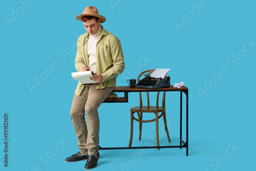 Young man with notebook and...