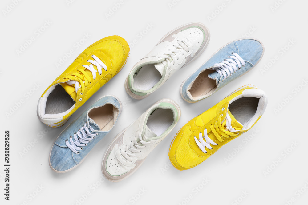 Different sneakers on white background. Top view Different sneakers on white background. Top view