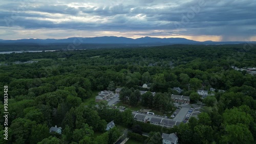 aerial drone view of rhinebeck new york (small town in hudson valley) university college city (sunset dusk mountains in distance) main street photo