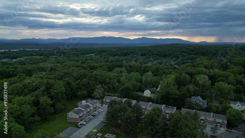 aerial drone view of rhinebeck new york (small town in hudson valley) university college city (sunset dusk mountains in distance) main street photo