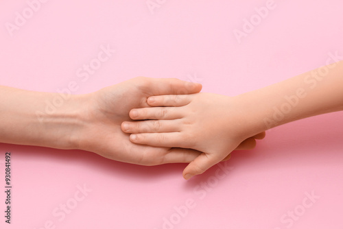 Female and child's hands on...