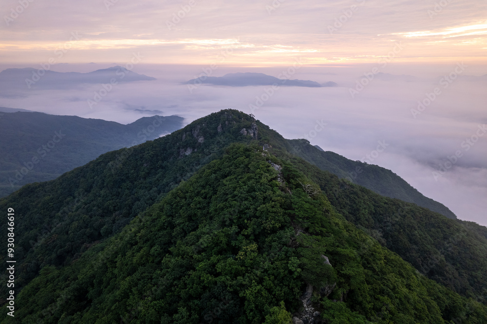 Misty clouds and mountains during sunrise Misty clouds and mountains during sunrise