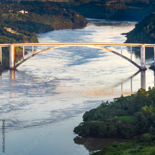 Border between Brazil and Paraguay and connects Foz do Iguacu to Ciudad del Este. Ponte da Amizade in Foz do Iguacu. Aerial view of the Friendship Bridge with Parana river.