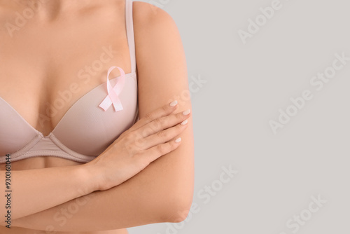 Young woman in bra with pin...