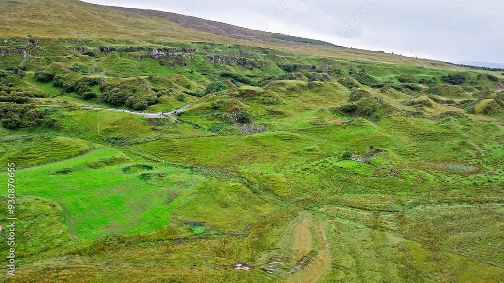 Aerial view of Scenic point The Fairy Glen in Isle of Skye, Scotland. Basalt hilltop resemble a ruined fort, overlooking a glen linked to fairy mythology in the United Kingdom.
Aerial view of Scenic point The Fairy Glen in Isle of Skye, Scotland. Basalt hilltop resemble a ruined fort, overlooking a glen linked to fairy mythology in the United Kingdom.