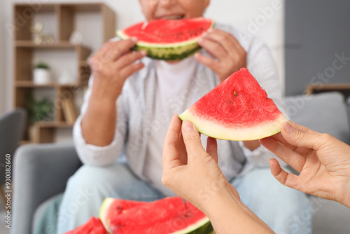 Mature woman with slice of ...