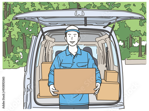 車の前で段ボール箱を持つ作業服姿の男性