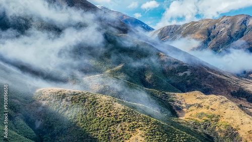 Aerial view of the mountains shrouded in cloud in Torlesse Tussocklands Park photo