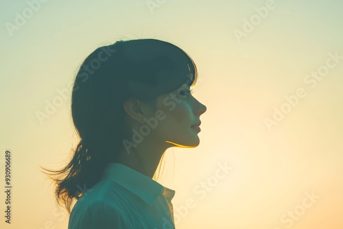 Contemplative side profile of a woman in a calm serene outdoor setting with soft natural lighting symbolizing mindfulness reflection and the peaceful connection between nature and the human mind