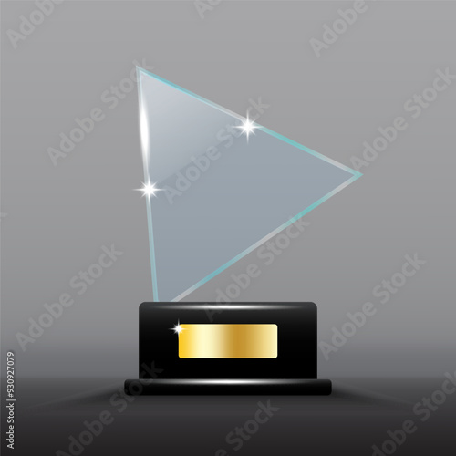 Glass trophy award. Transparent triangular shape with shining highlights. Black base with gold plate.