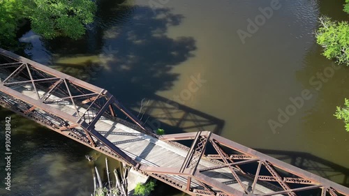 Springtown Railway Bridge over River in Springtown, New York Wallkill Valley Rail Trail (Paltz trestle viaduct) aerial drone view steel beams bars wooden platform from above trees scenic bike trail photo