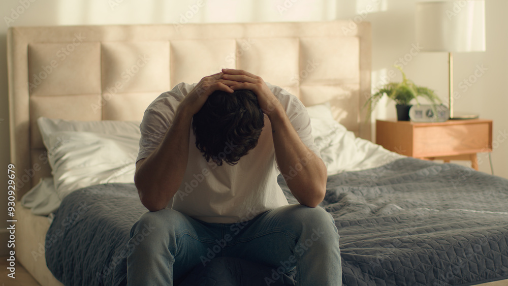 Unhappy Caucasian European man holding head problem crisis breakup male guy bedroom credit debt serious trouble hopelessness depressed grief despair difficulty disappointment sadness emotional stress Unhappy Caucasian European man holding head problem crisis breakup male guy bedroom credit debt serious trouble hopelessness depressed grief despair difficulty disappointment sadness emotional stress