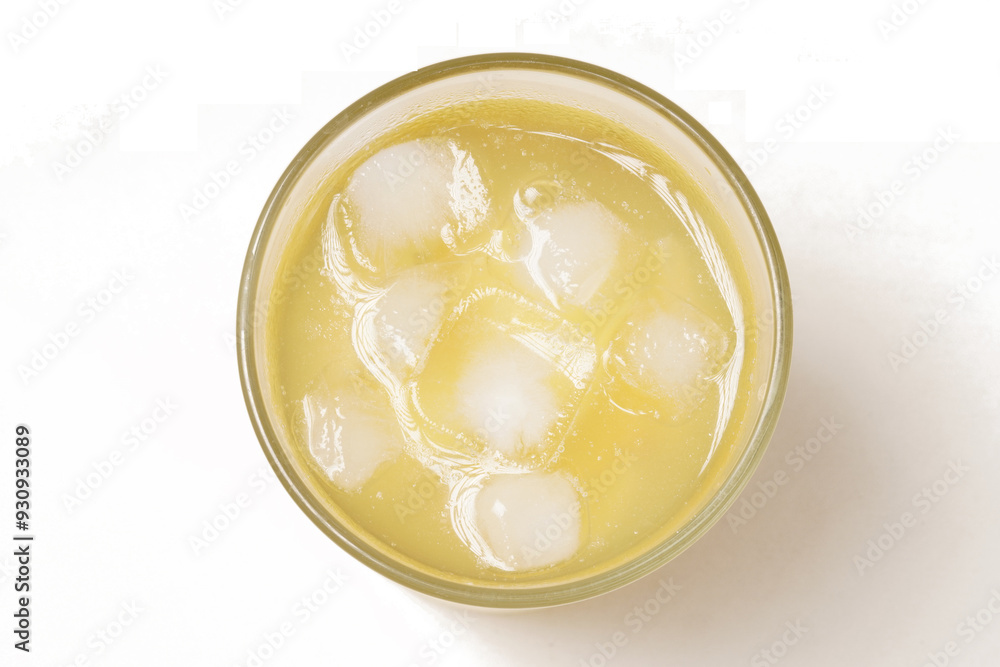 A glass of iced young mango setup, made with thinly sliced tangy yellow mango, sweetened with sugar water, pandan, cinnamon, and a hint of salt. Photographed with a white background. A glass of iced young mango setup, made with thinly sliced tangy yellow mango, sweetened with sugar water, pandan, cinnamon, and a hint of salt. Photographed with a white background.