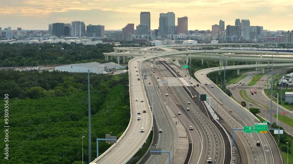 Elevated freeway in American city of Tampa, Florida with fast moving cars. USA transportation infrastructure concept. Elevated freeway in American city of Tampa, Florida with fast moving cars. USA transportation infrastructure concept.
