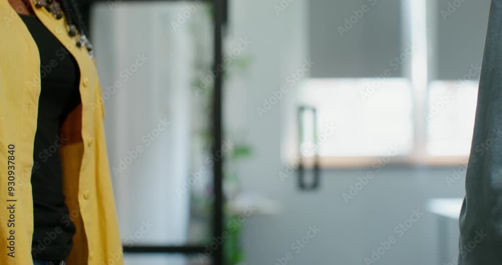 A man and a woman shake hands standing indoors, close-up of their hands, unrecognizable persons A man and a woman shake hands standing indoors, close-up of their hands, unrecognizable persons