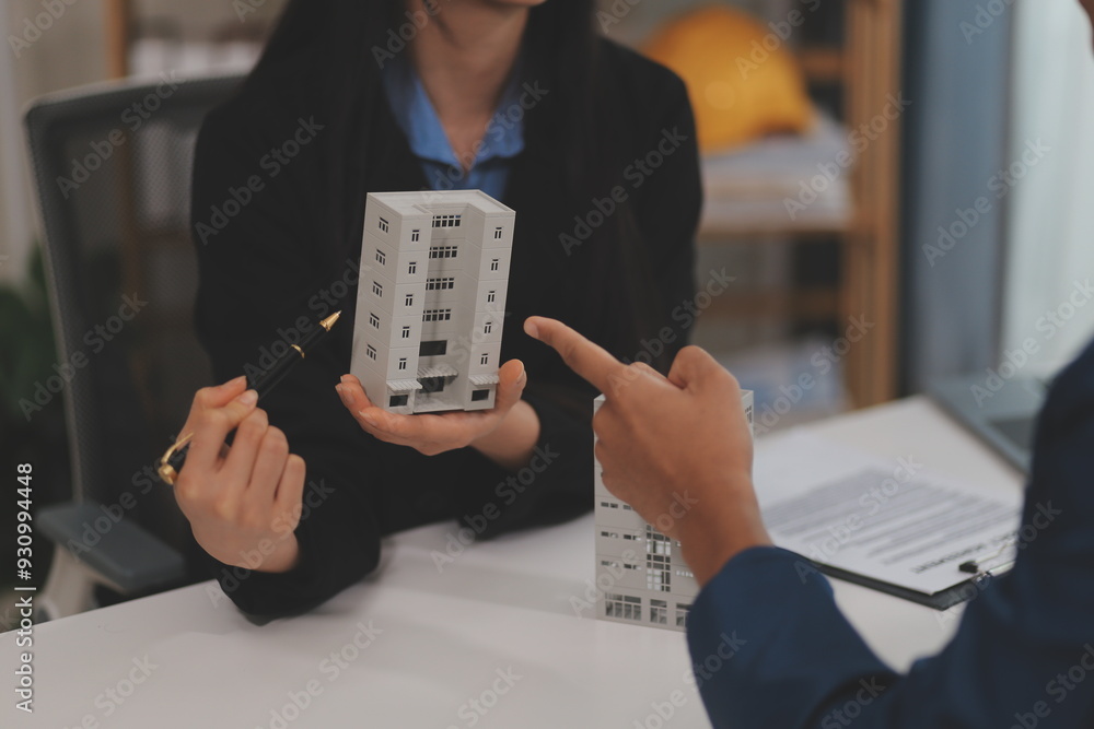 Sale representative offer house purchase contract to buy a house or apartment or discussing about loans and interest rates Sale representative offer house purchase contract to buy a house or apartment or discussing about loans and interest rates