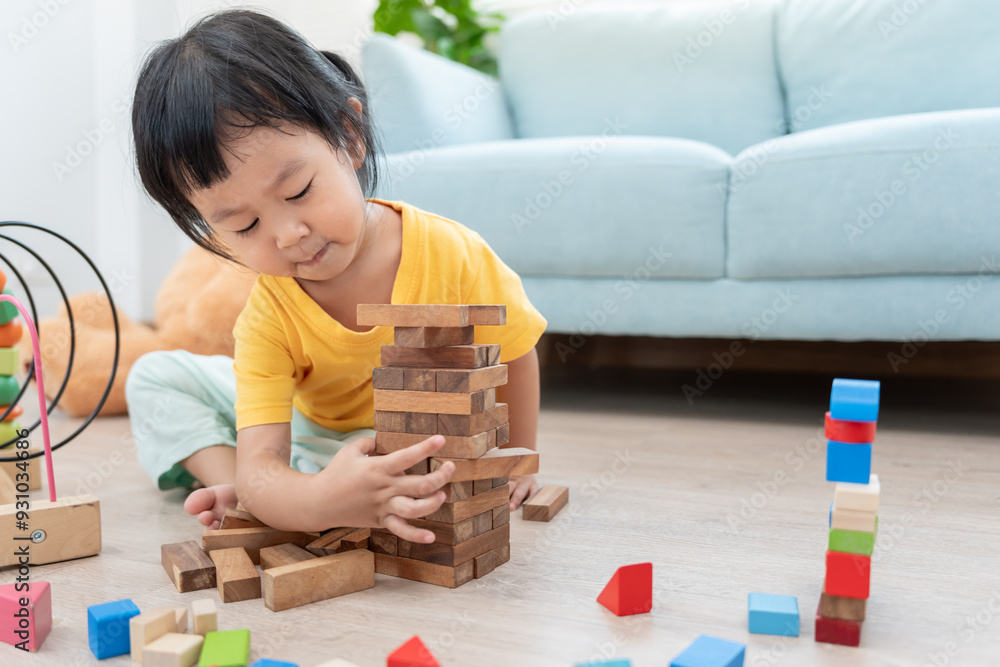 Happy Asian child playing and learning toy blocks. children are very happy and excited at home. child have a great time playing, activities, development, attention deficit hyperactivity disorder Happy Asian child playing and learning toy blocks. children are very happy and excited at home. child have a great time playing, activities, development, attention deficit hyperactivity disorder