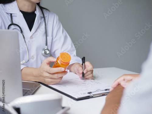 Asian female doctor explains medicine to patient and treats patient according to diagnosis medical and health concept photo