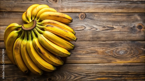 Close-up of ripe pl?tanos on a wooden table , bananas, fruit, plantain, tropical, yellow, healthy, organic, food photo