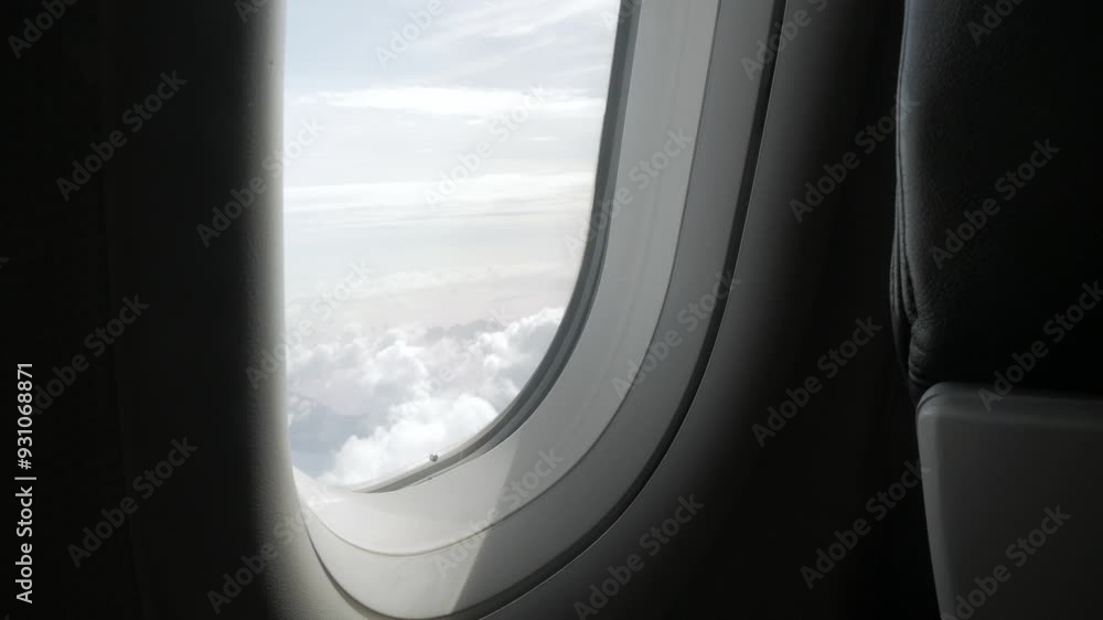 through the window of the airplane from inside cabin while flyiing climbing into the sky above the cloudscape outside in summer day,natural transportation holiday vacation background through the window of the airplane from inside cabin while flyiing climbing into the sky above the cloudscape outside in summer day,natural transportation holiday vacation background