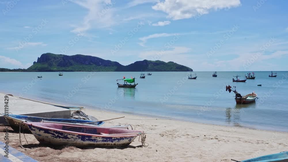 Landscape of traditional colorful thai old wooden fishing boats on shore during low tide. Traditional Thai long-tailed fishing boats in tropical sea Landscape of traditional colorful thai old wooden fishing boats on shore during low tide. Traditional Thai long-tailed fishing boats in tropical sea