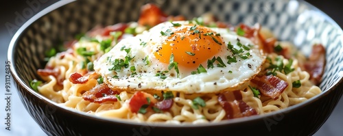 A colorful bowl of ramen carbonara, featuring creamy noodles, crispy bacon, and a poached egg, Ramen carbonara fusion, comforting and rich photo