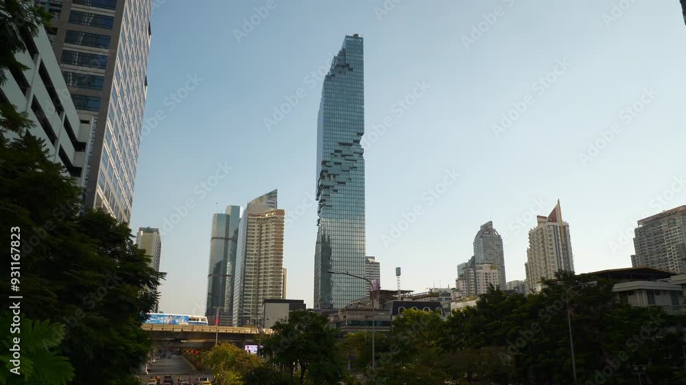 sunny evening bangkok city center metro line traffic famous skyscraper tower exterior street slow motion view 4k thailand sunny evening bangkok city center metro line traffic famous skyscraper tower exterior street slow motion view 4k thailand
