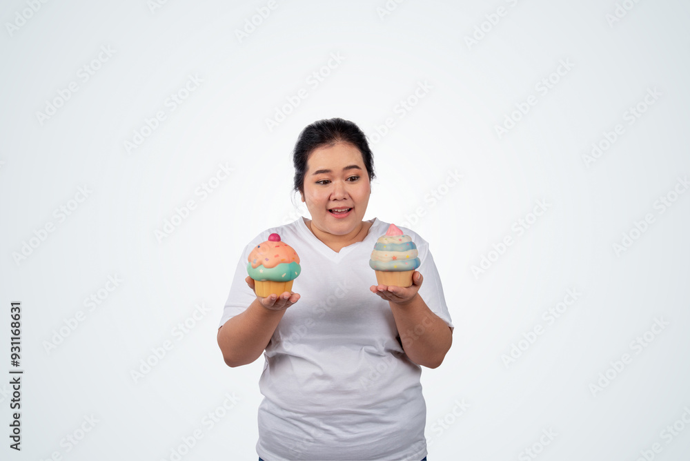 Portrait of happy young plus size woman, holding a mock up ice cream and smiling on white isolated background,can be use as a visual to communicate for consumption of junk food. Portrait of happy young plus size woman, holding a mock up ice cream and smiling on white isolated background,can be use as a visual to communicate for consumption of junk food.