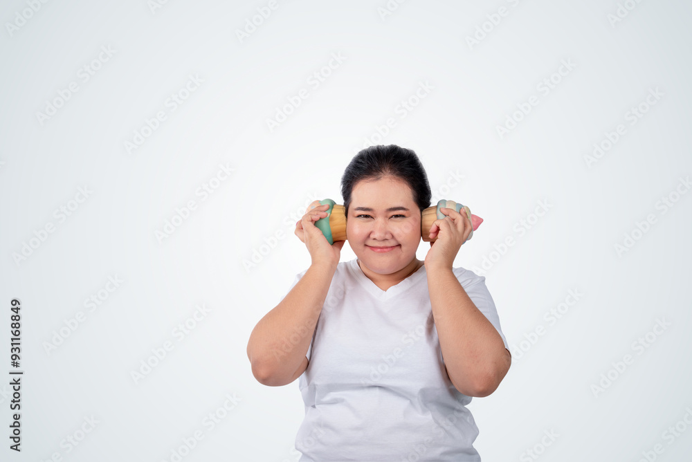 Portrait of happy young plus size woman, holding a mock up ice cream and smiling on white isolated background,can be use as a visual to communicate for consumption of junk food. Portrait of happy young plus size woman, holding a mock up ice cream and smiling on white isolated background,can be use as a visual to communicate for consumption of junk food.