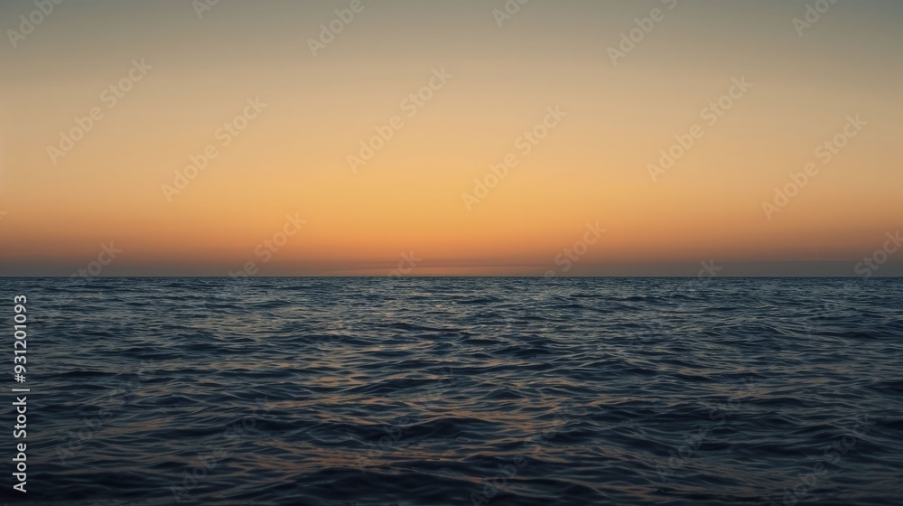 Seascape featuring an orange sky, capturing the serene beauty of the ocean as the sun sets, casting warm hues across the water's surface. Seascape featuring an orange sky, capturing the serene beauty of the ocean as the sun sets, casting warm hues across the water's surface.