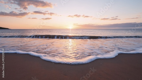 Walking on the beach at sunset, with the sky painted in hues of pink and orange, and waves gently lapping at the shore.