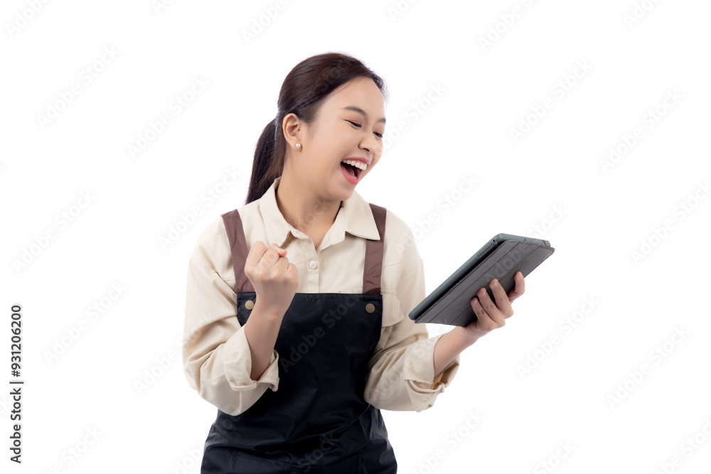 Portrait young asian barista woman wearing an apron celebrating success while using a tablet isolated white background, woman expression with satisfied and happy about small business with success. Portrait young asian barista woman wearing an apron celebrating success while using a tablet isolated white background, woman expression with satisfied and happy about small business with success.
