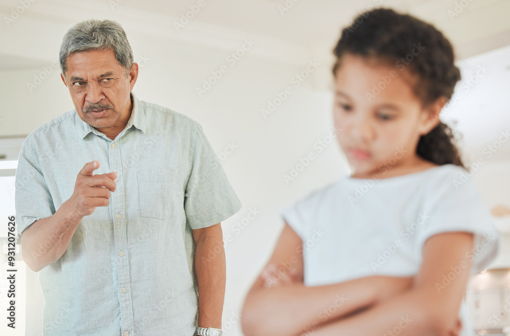 Obraz premium Senior man, irritated and girl in home with point, lesson and discipline for behavior in Mexico. Elderly person, grandfather and scold at child with arms crossed, frustrated or talk in family house
