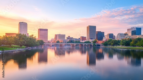 A serene cityscape at sunset reflecting on a river, showcasing urban architecture and nature.