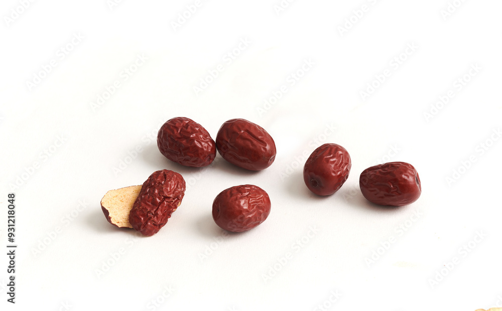 Dried red dates isolated on a white background. They are a traditional herb used in Chinese medicine. Full depth of field. Dried red dates isolated on a white background. They are a traditional herb used in Chinese medicine. Full depth of field.
